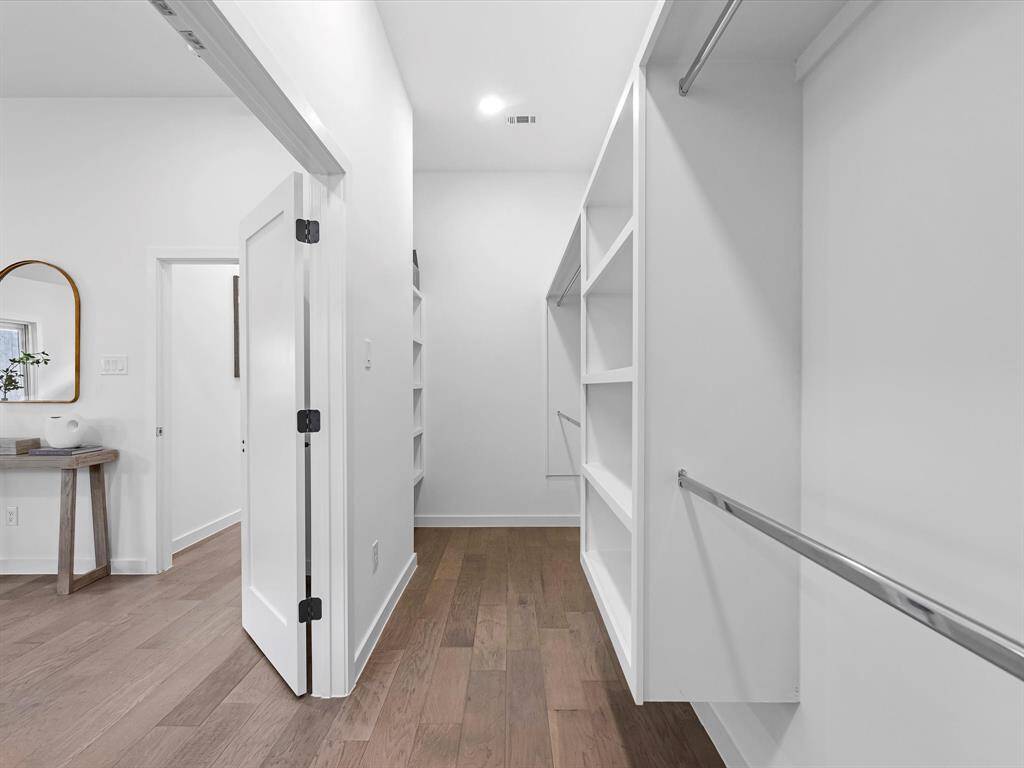 Primary bedroom walk-in closet