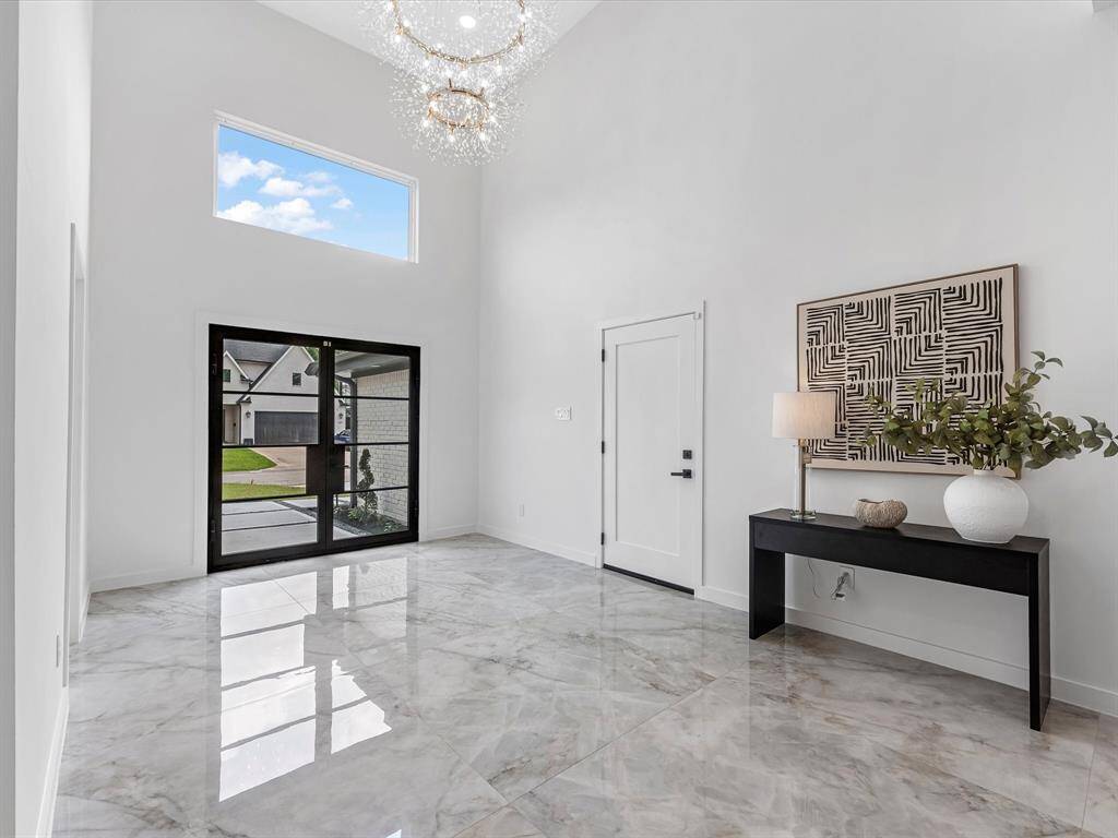 16 foot ceiling with statement piece Chandelier