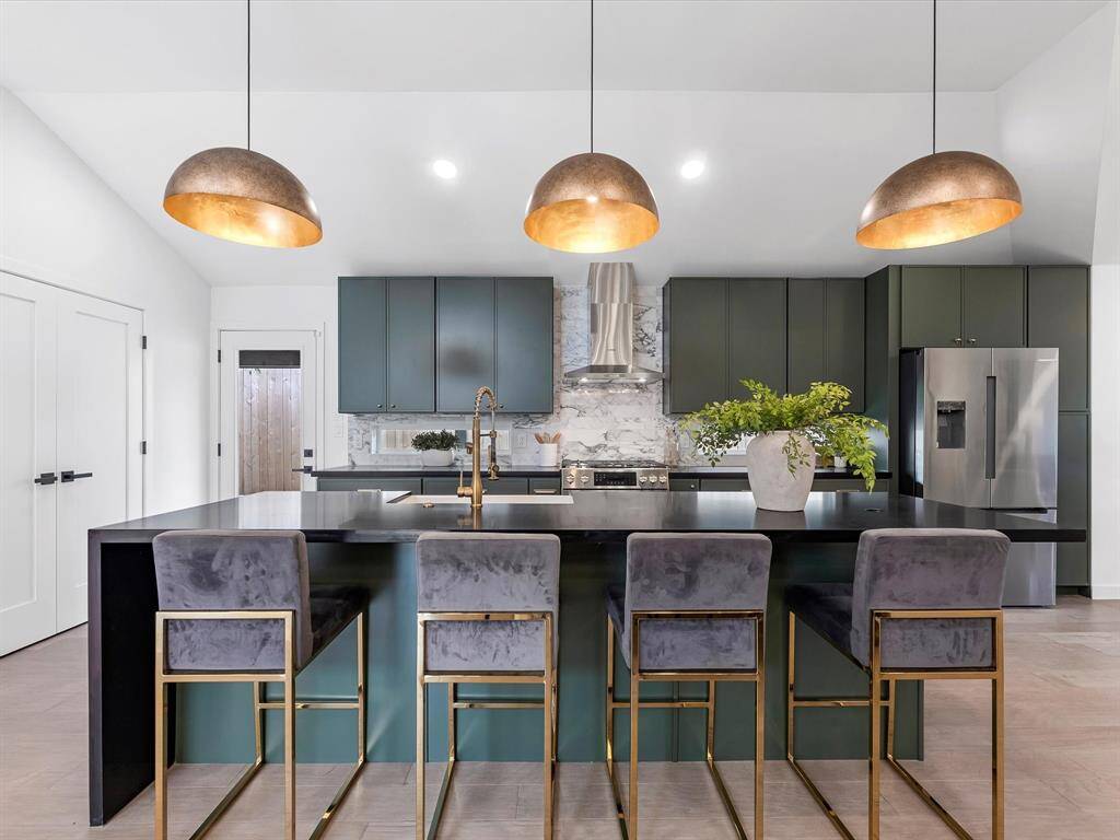 Kitchen with Bosch appliances and plenty of seating around the island