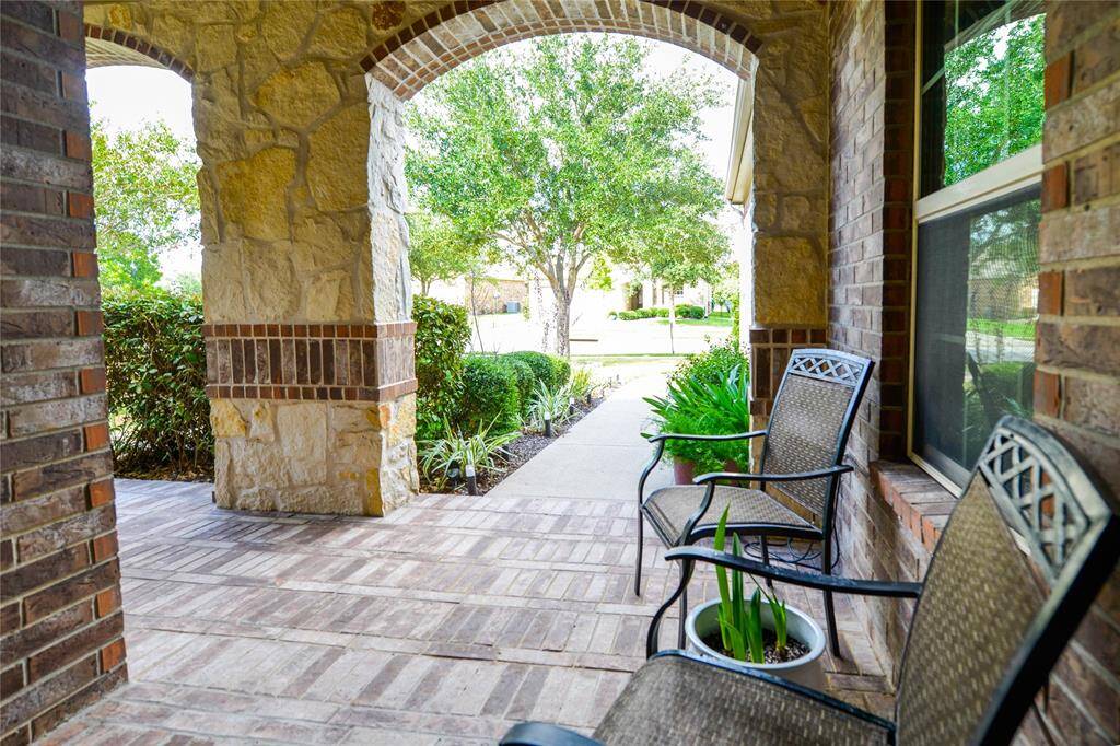 Attractive Brick paved front porch makes a grand entry.