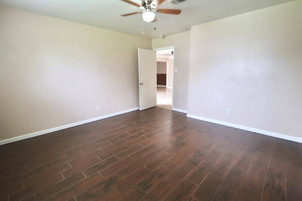 Primary bedroom with spacious layout that creates a warm and inviting atmosphere