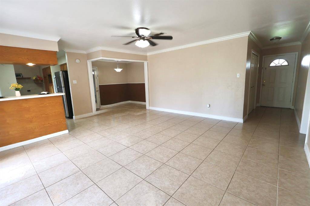 Open and functional living area designed with families in mind, featuring a spacious layout that allows easy interaction between the kitchen, dining, and living zones