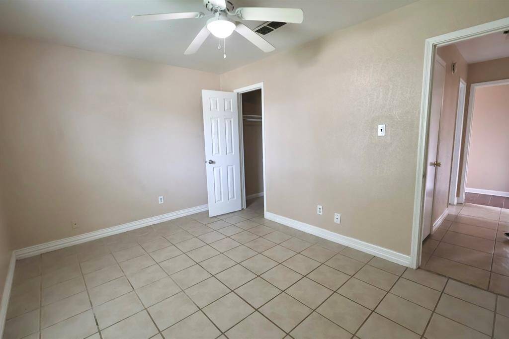 Third bedroom located at the front of the property, with walk in closet and new fan