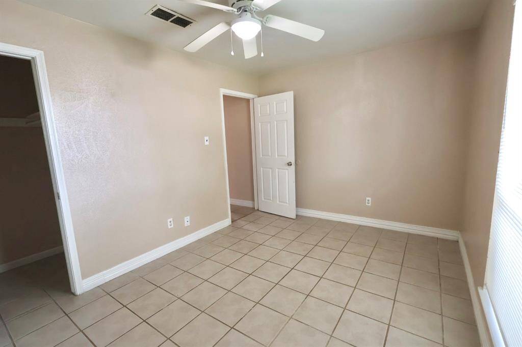 Well-sized bedroom with a generous walk-in closet, perfect for extra storage and everyday convenience