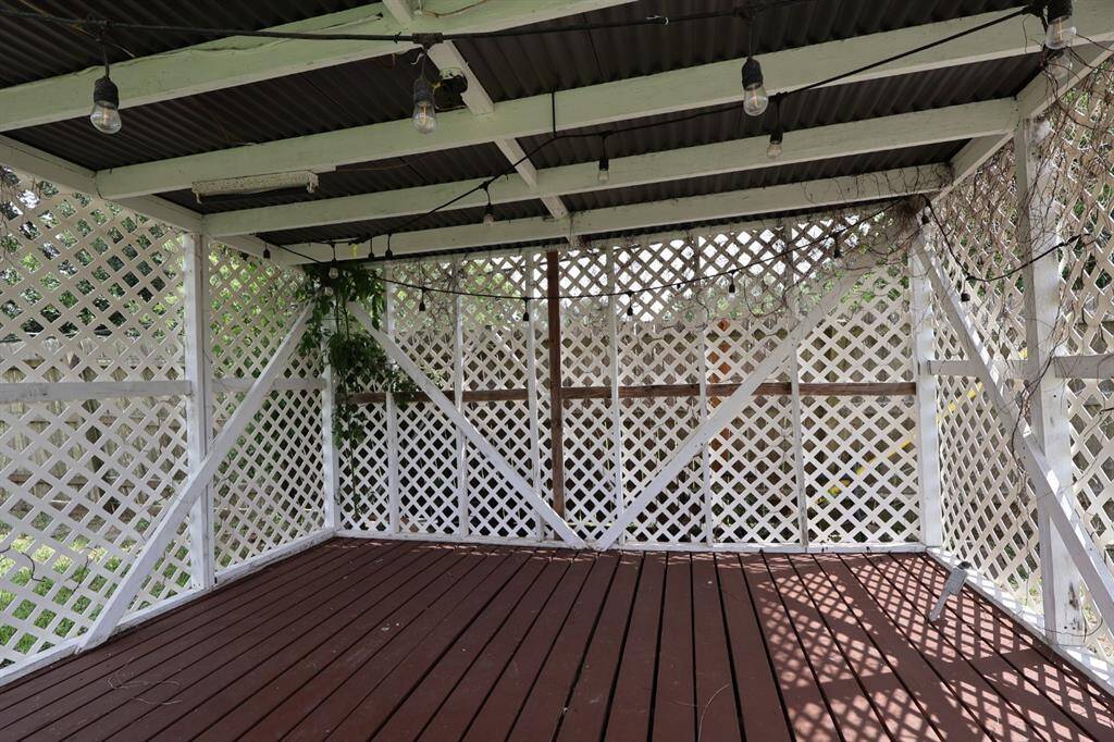 Inviting gazebo nestled in the yard, creating a cozy and sheltered retreat ideal for outdoor lounging and special occasions