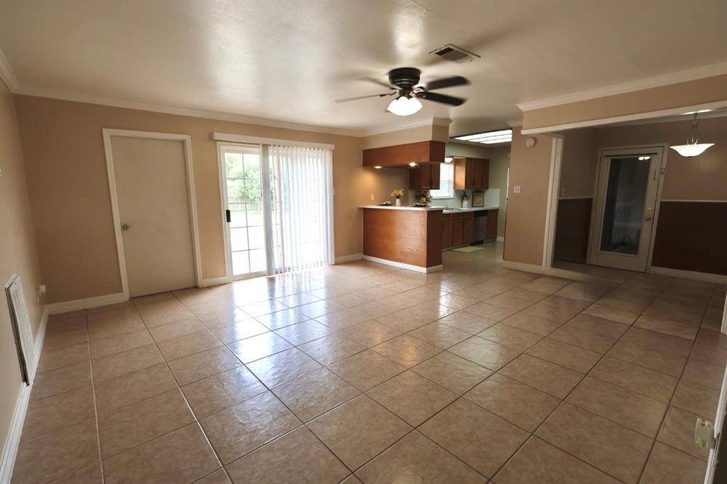 Spacious open floor plan seamlessly connecting the kitchen, dining, and living areas, creating an airy, versatile space perfect for everyday living and entertaining