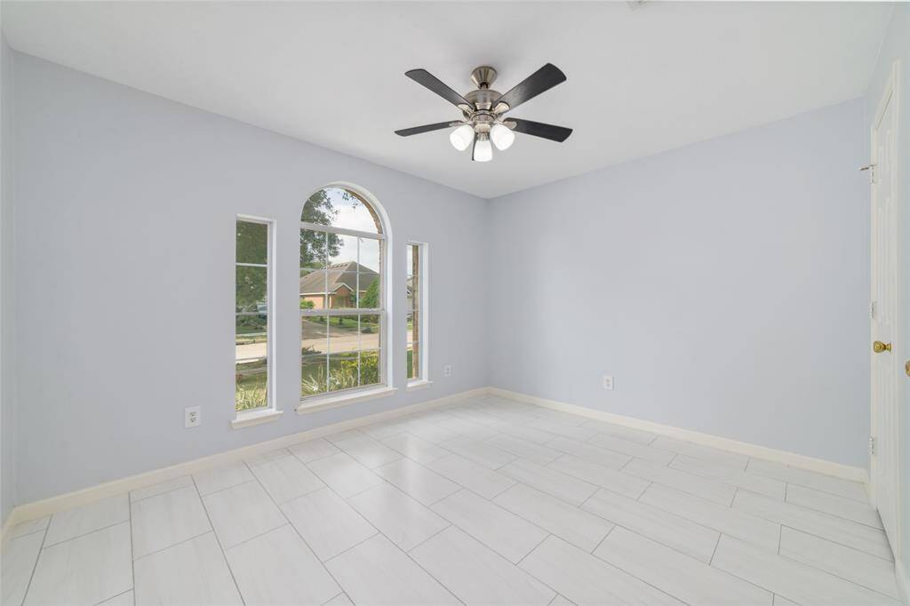 Bedroom 2 with large fan window
