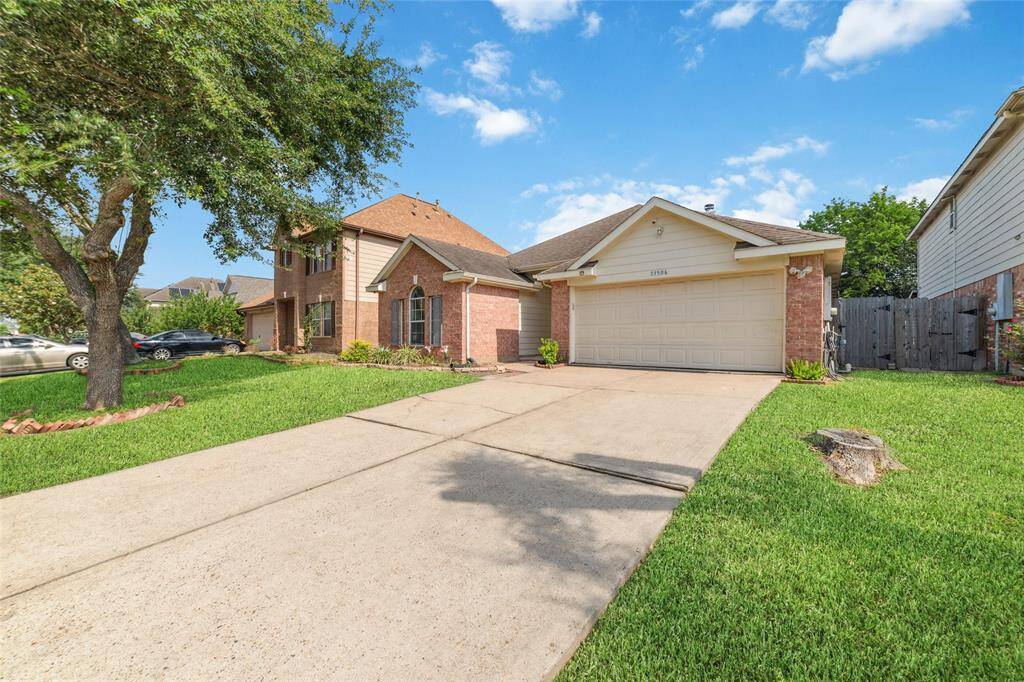 Front elevation with long driveway for extra parking