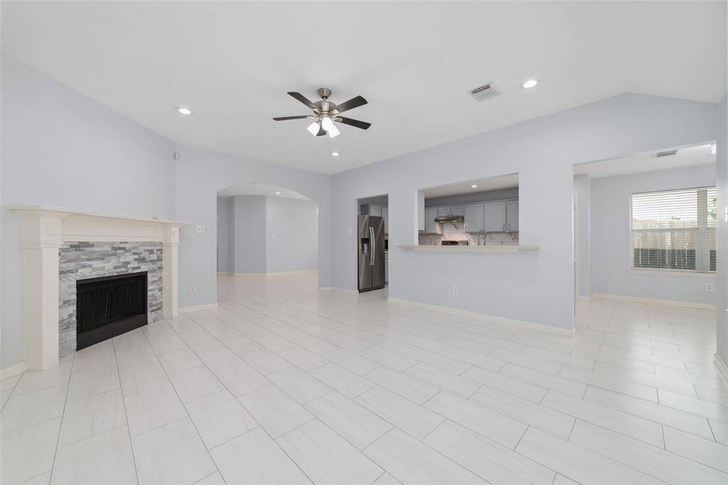 Family room with open connection to kitchen and eat in kitchen