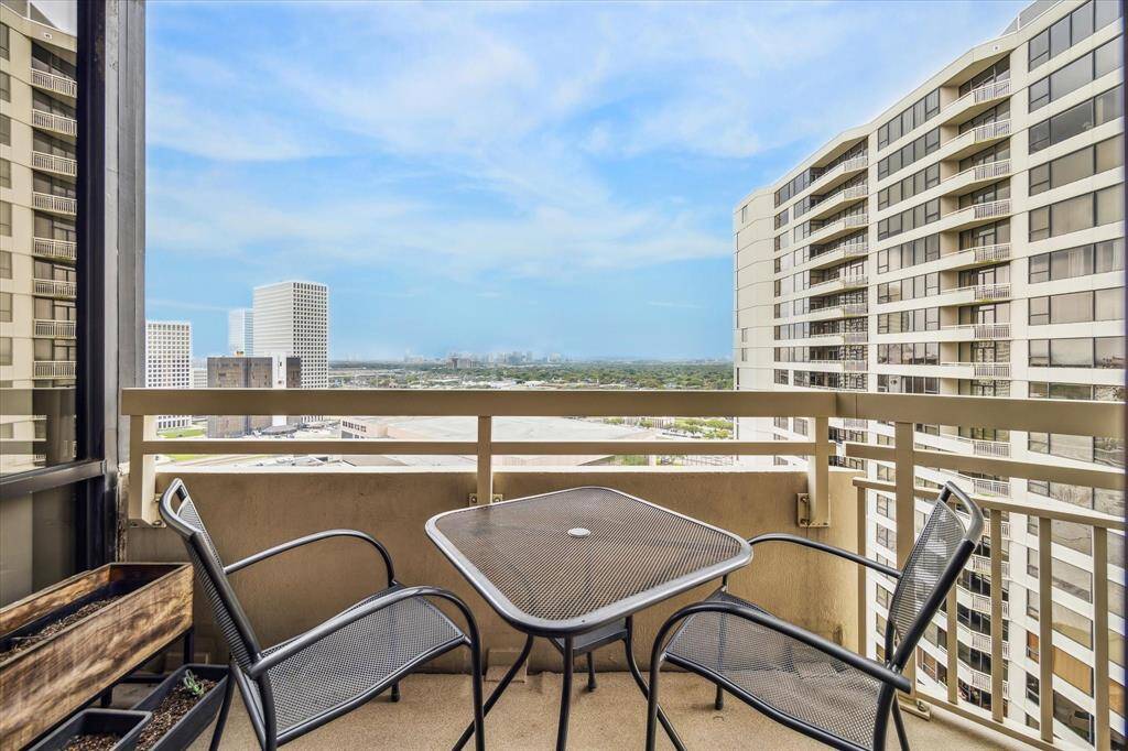 Step onto the cozy balcony, where you can unwind and enjoy breathtaking views of the city skyline.