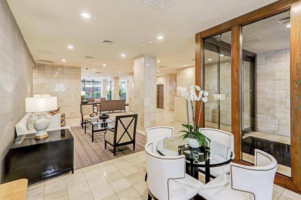 Enter through the elegant lobby, a welcoming common area designed to impress with its spacious layout, stylish decor, or contemporary design.