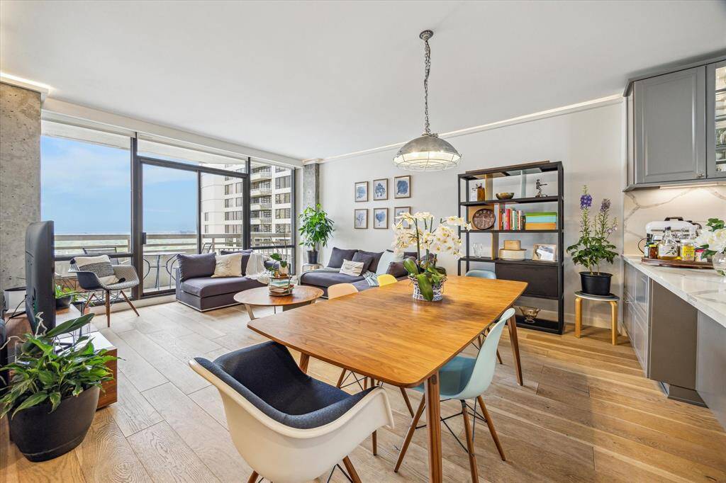 Welcome to a sophisticated sanctuary where style meets comfort. This exquisite unit offers an open-concept living and dining room floorplan and it effortlessly blends modern design with timeless elegance, creating the perfect setting for both relaxation and entertainment.