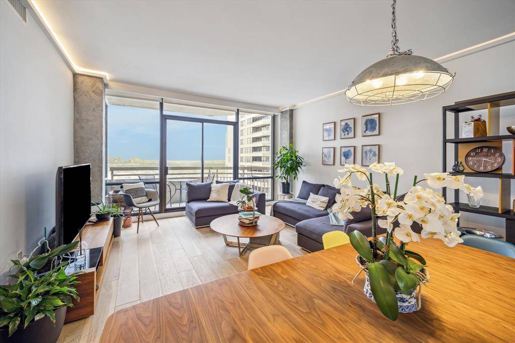 This layout adds warmth and ambiance, while the sleek hardwood floors provide a seamless flow throughout the space.
