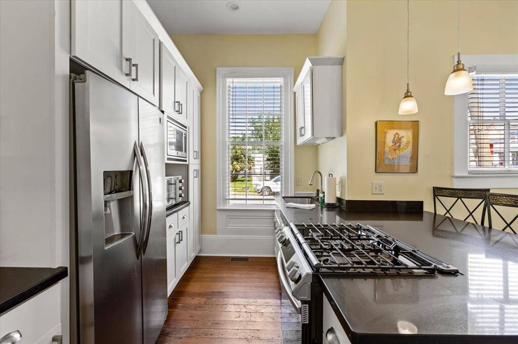 Kitchen features lots of cabinets and stainless steel appliances