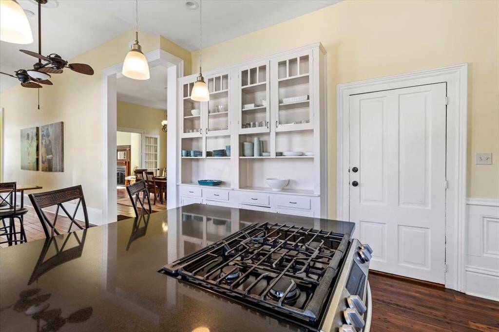Kitchen with adjacent built-in cabinetry.