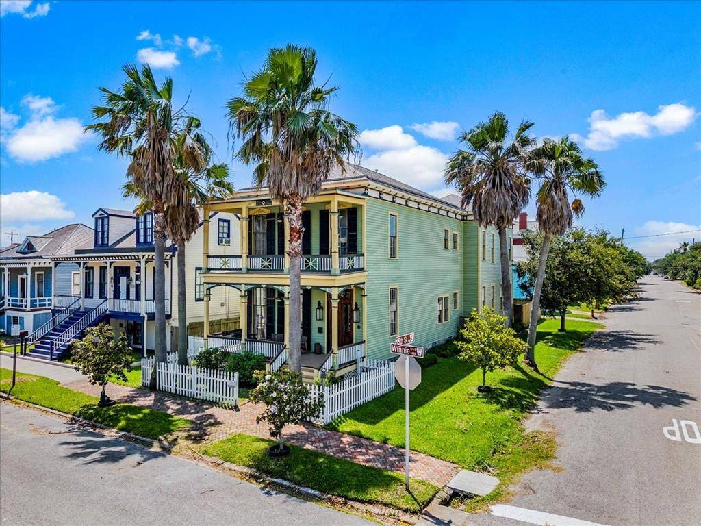 Large corner lot with lush landscaping and beautiful magnolia trees