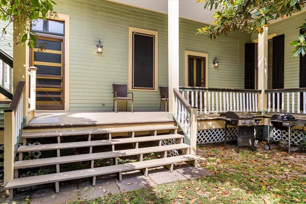 1st story balcony complete with walk through windows and storage room overlooks the backyard