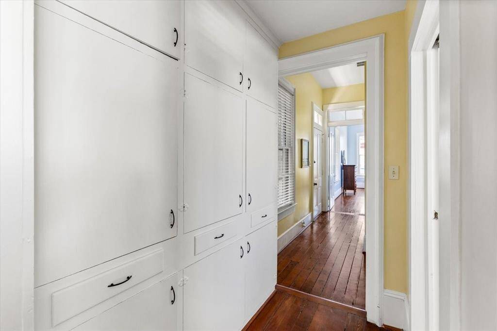 Built in storage conveniently located outside the hallway bath and adjacent to the laundry room