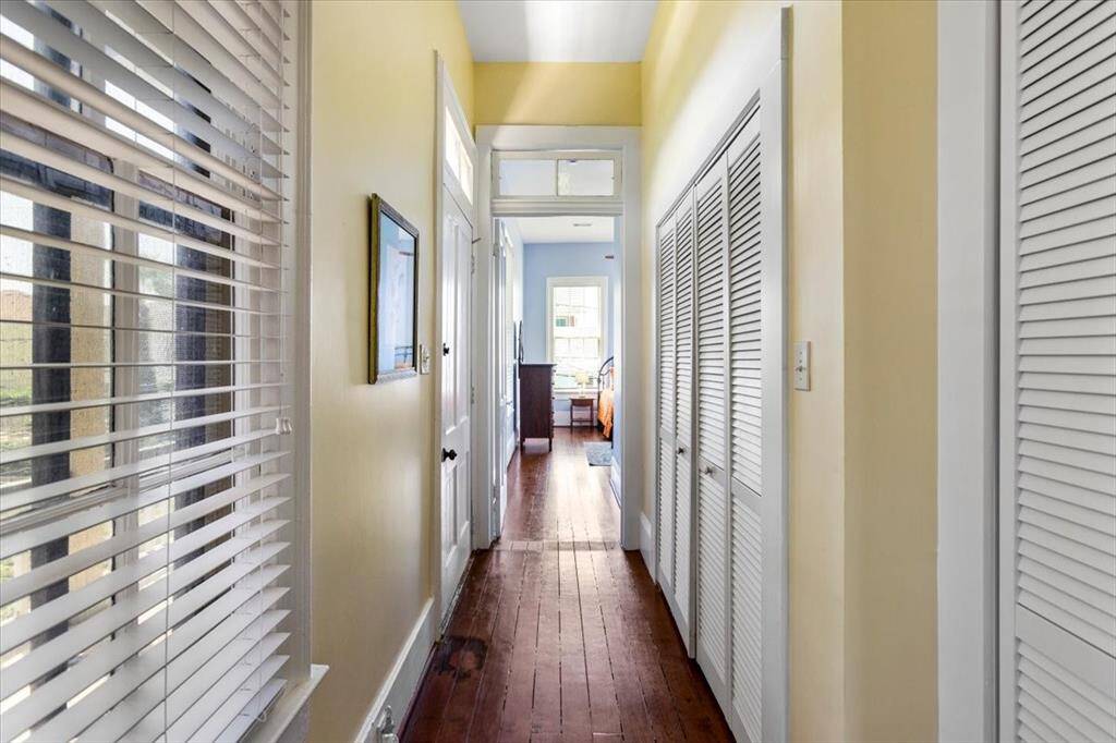 Laundry room with washer and dryer located on the right side of the hall. All appliances are included with the home.