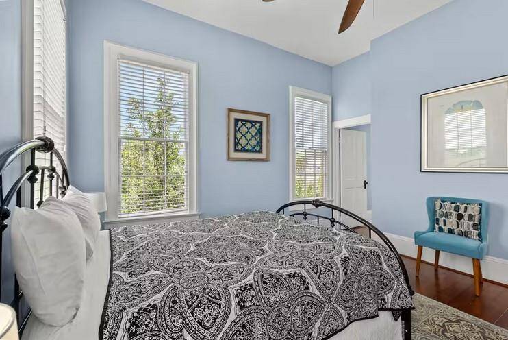 2nd Primary bedroom with en suite located at the rear of the home overlooks the backyard and balcony.