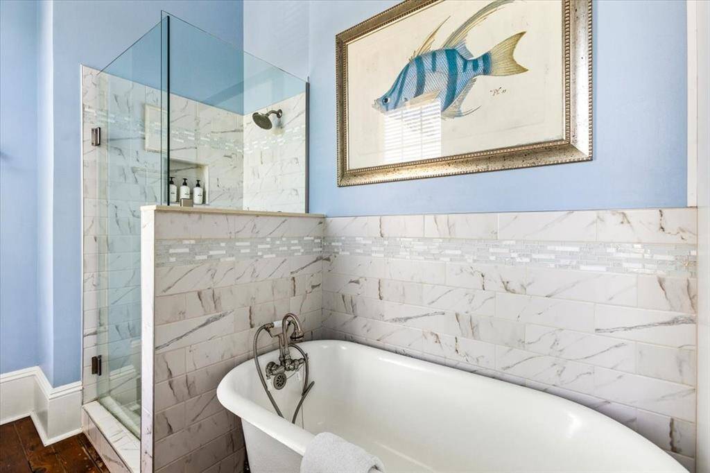 En suite located at the rear of the home in 2nd Primary bedroom.