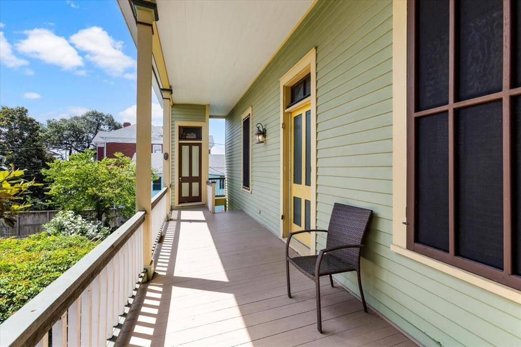 Second story balcony with storage room