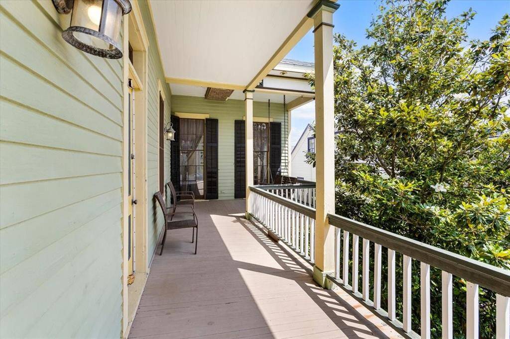 Second story balcony with walk through windows