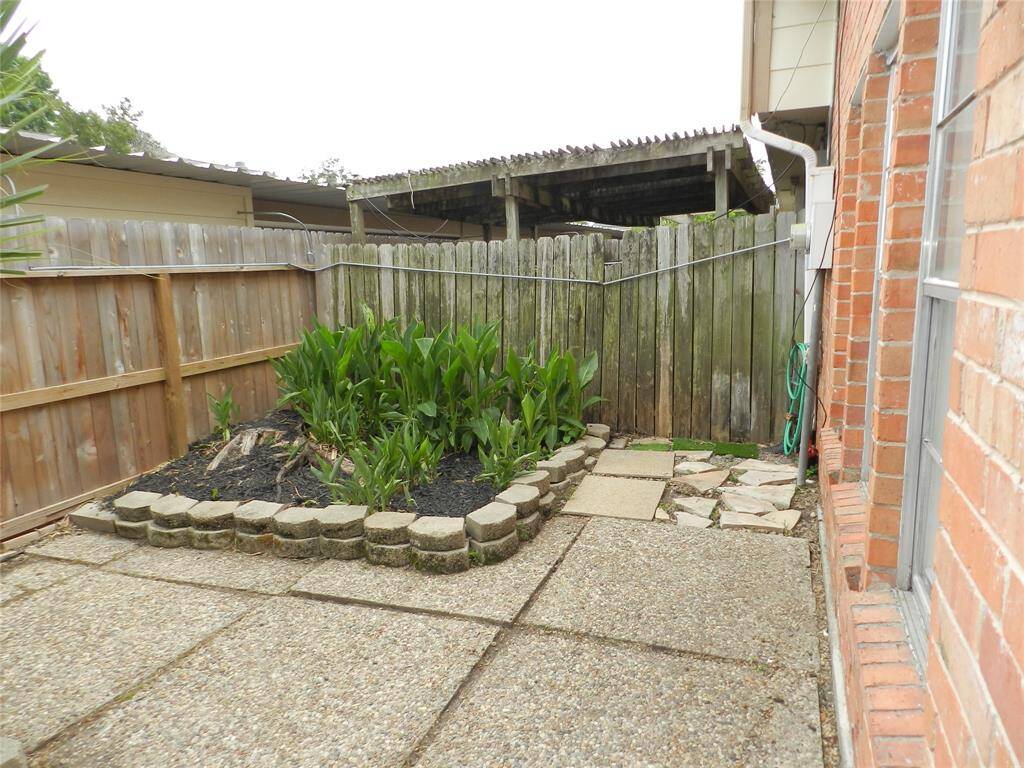Large patio area with green spaces