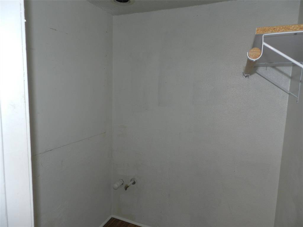 Wet bar that has been closed off and converted to a closet but can easily be converted back or converted to alternate utility room