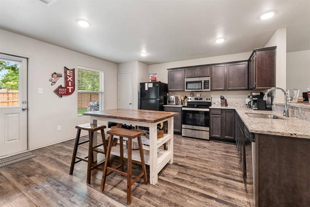 Kitchen with appliances and dining area
