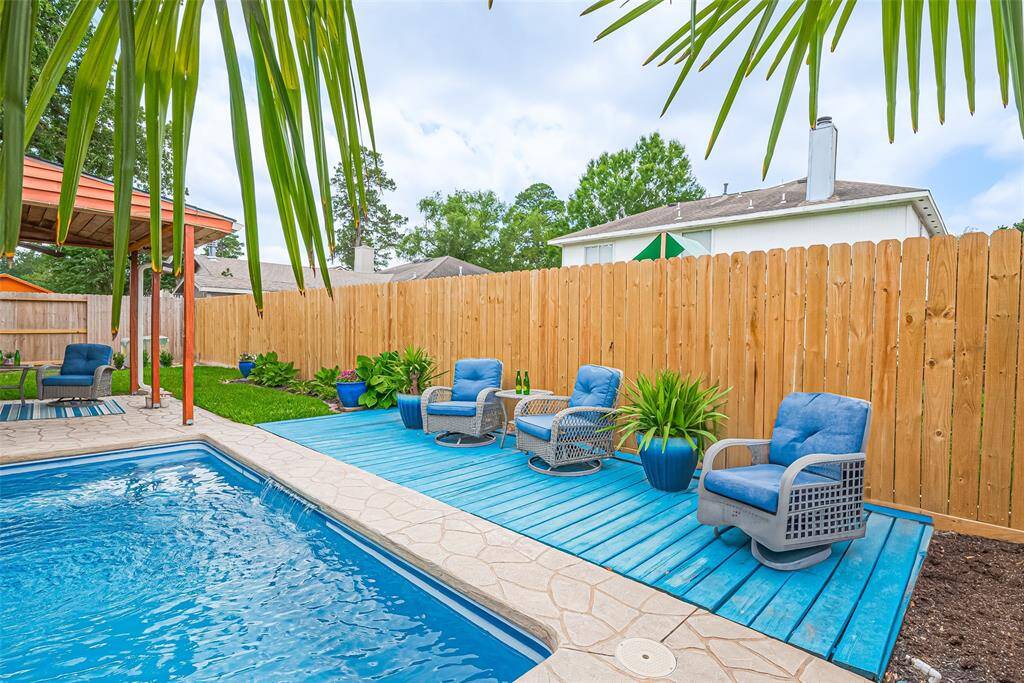 Relax in your private oasis, featuring a small sparkling pool, lush greenery, and comfortable seating. Perfect for unwinding or entertaining.