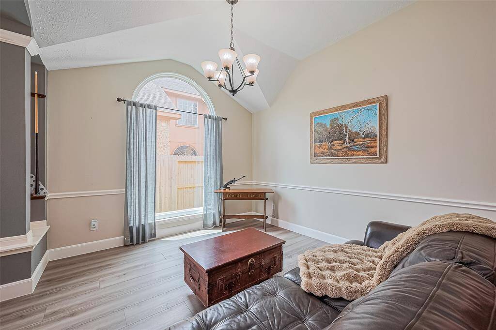 Step into a spacious and inviting area perfect for recreation and relaxation.