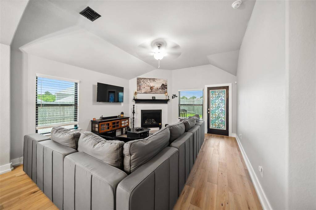 The corner fireplace with gas logs will make a cozy place to watch a movie or read a book.
