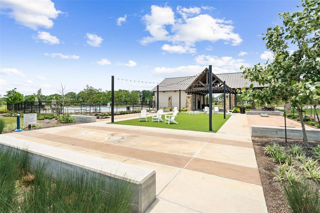 Neighborhood splash pad, pavilion, and pool in the background.