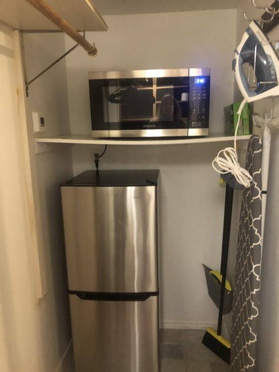 small fridge and microwave in king and queen room