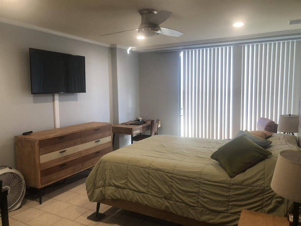 Queen room has 2 end tables, dresser, desk w/chair, tv w/cable