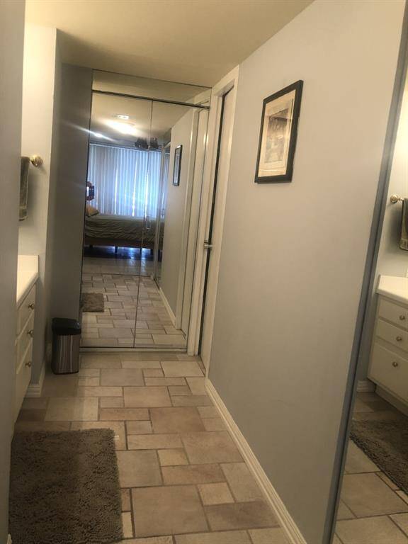 Queen bathroom sink area, plenty of extra towels and bed ware