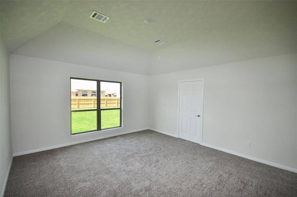 Enjoy the spacious view into the rear yard from the master.