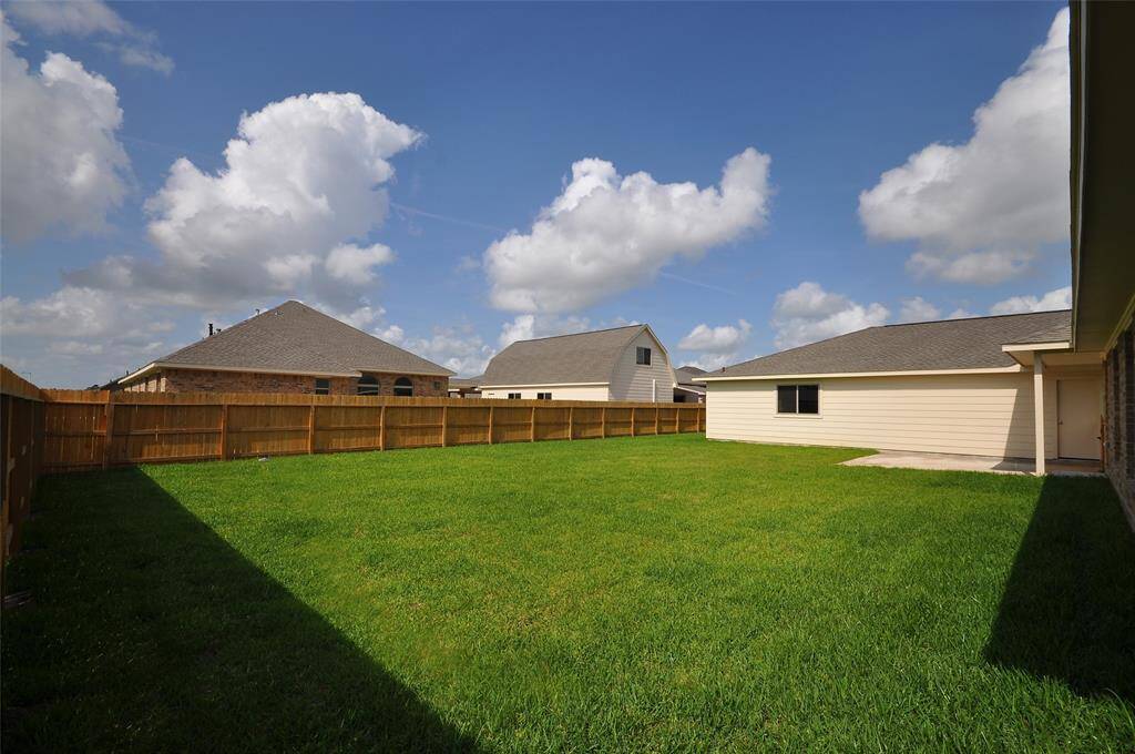 Very roomy rear yard is fully sodded.