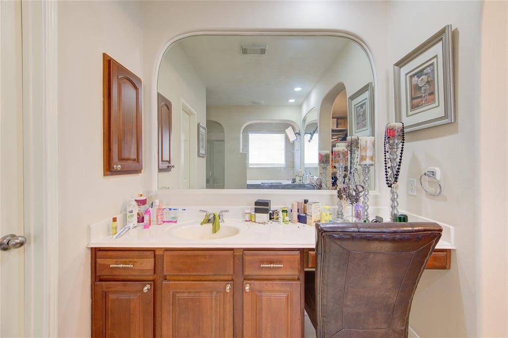 Dedicated vanity counter and mirror station perfect for getting ready.