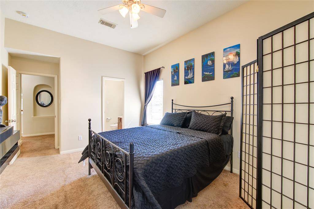 Additional view of guest bedroom with entry into private bath.