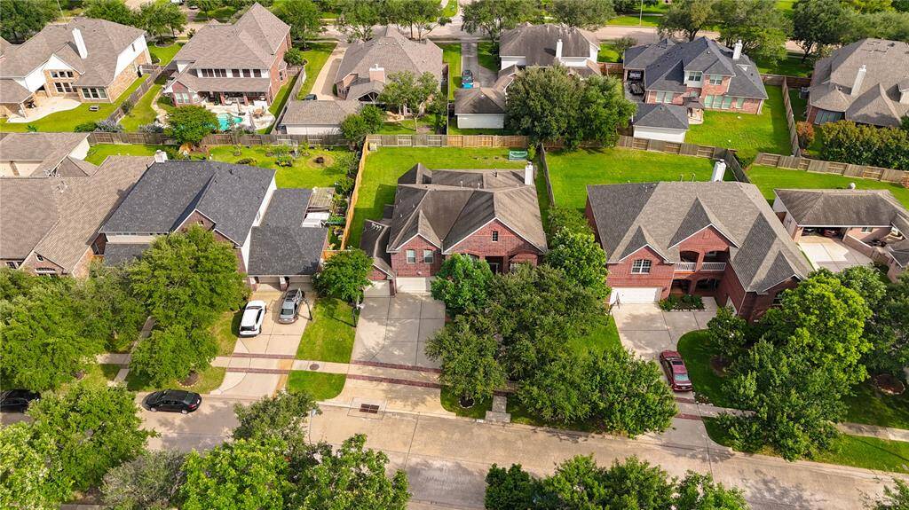 Straight-on aerial view highlighting lot size and proximity to neighbors.