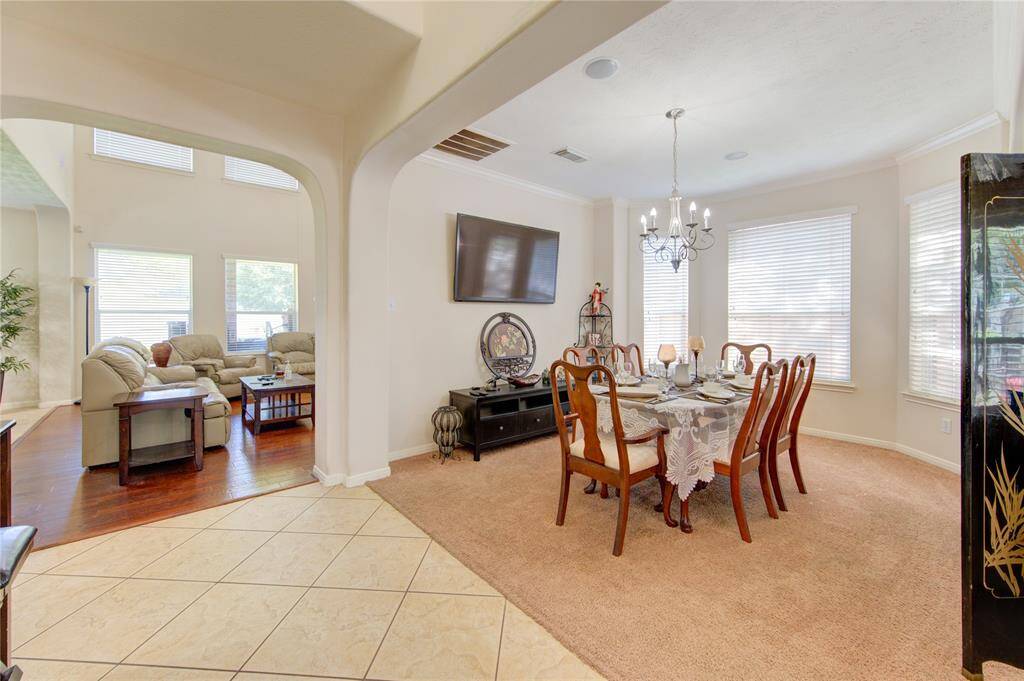 Formal dining area separates two living rooms