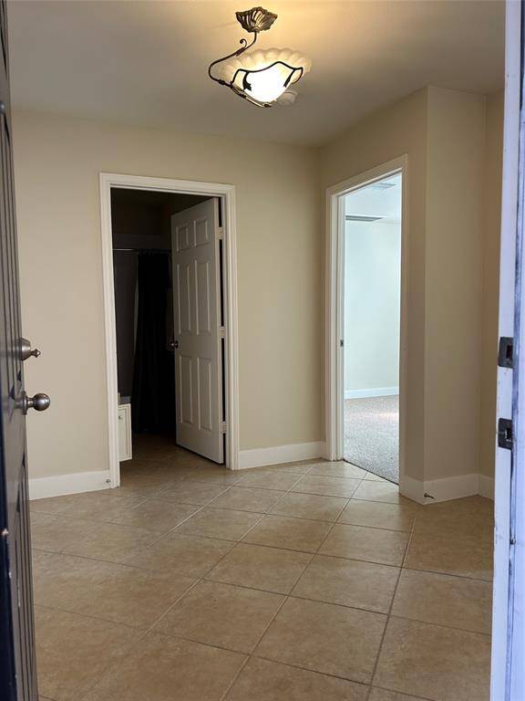 Welcome to 2333 Ann St! Step into a spacious entryway with tile flooring, offering immediate access to a first-floor bedroom, full bathroom, and a private patio retreat.