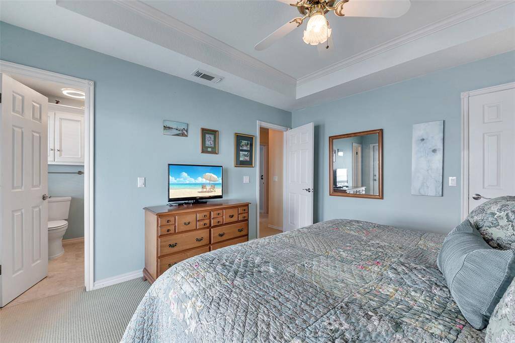The spacious primary bedroom includes a full ensuite bath, offering both privacy and comfort.