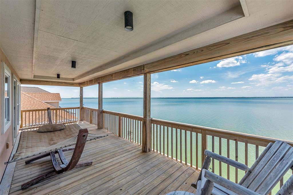 Connected to the upstairs bedrooms, enjoy endless water views on the covered balcony. You can catch the breeze, or just take in the view in peace.