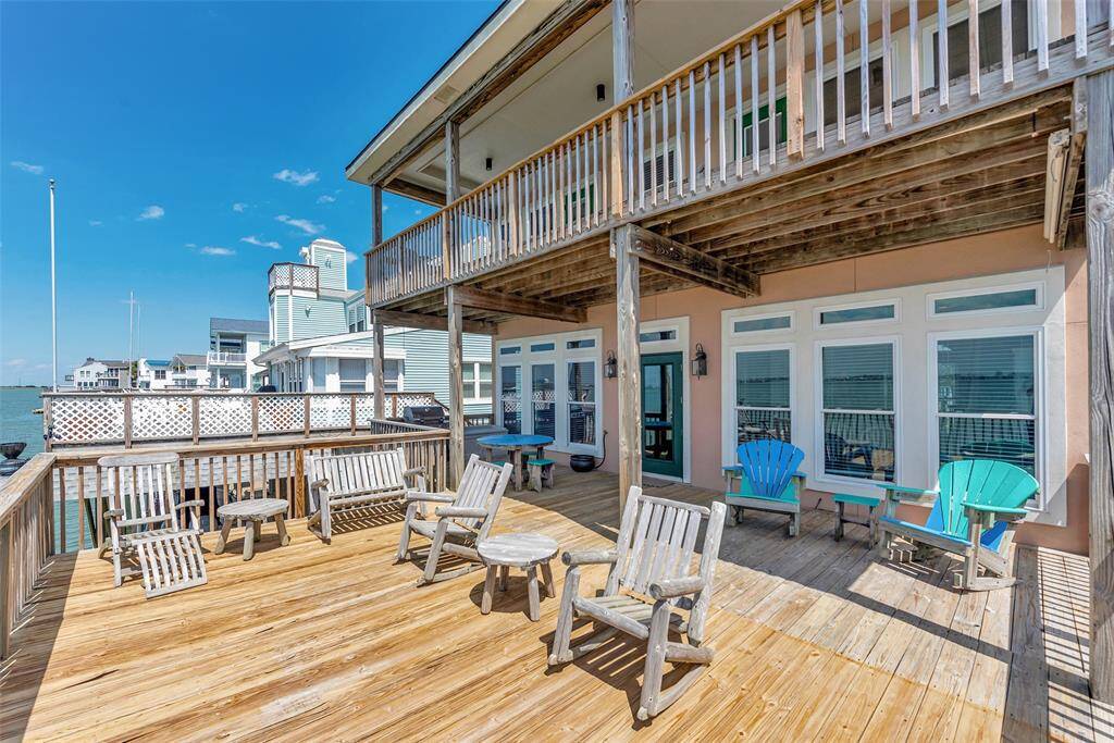 The lower deck is spacious and set up with chairs and tables, giving you a great place to relax right by the water.