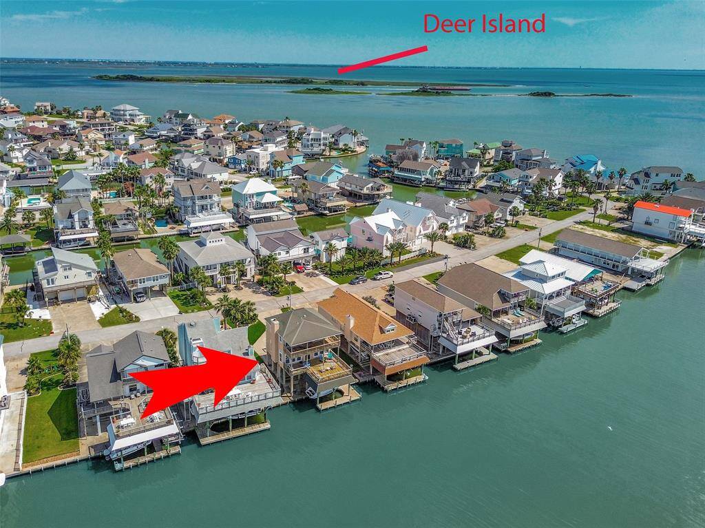 This home is perfectly situated right on the water, offering direct views across the bay and near Deer Island with convenient access to the Causeway.