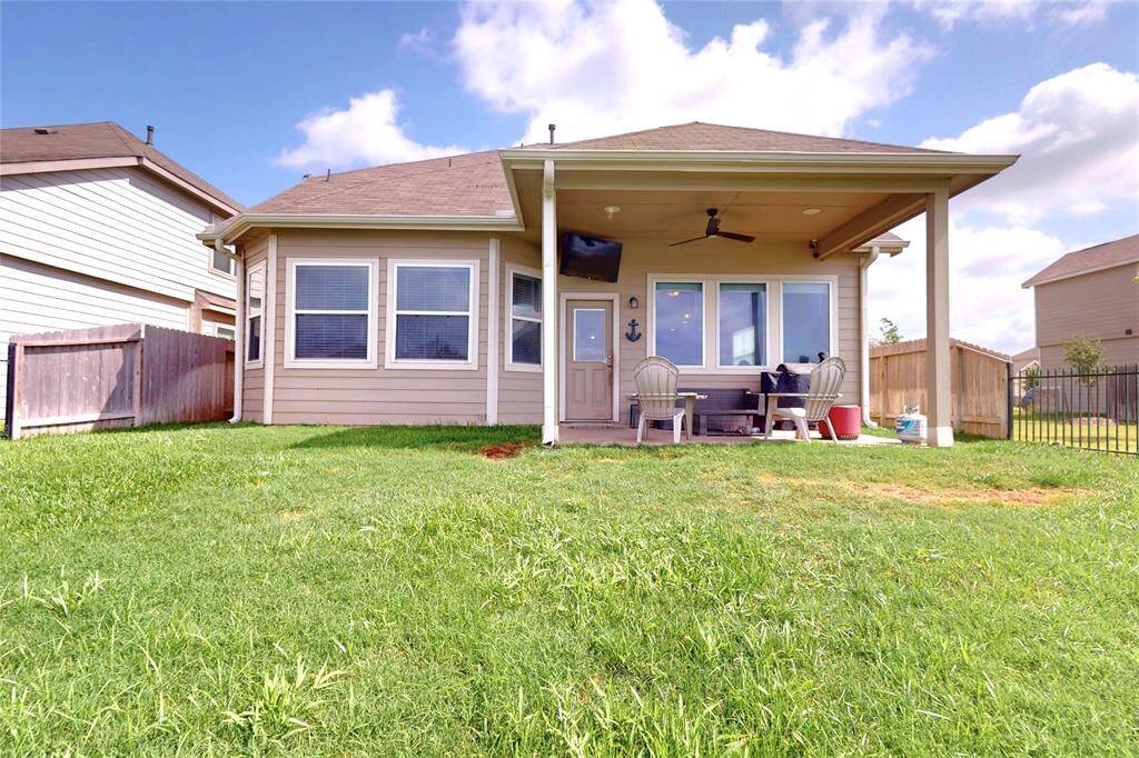Enjoy the outdoors from the comfort of your patio complete with speakers, a fan, and a mounted tv.