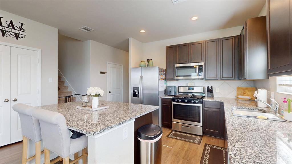 Kitchen complete with shining stainless steel appliances